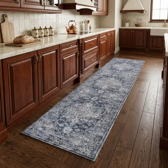 8' Blue and Ivory Floral Power Loom Distressed Washable Runner Rug Photo 1