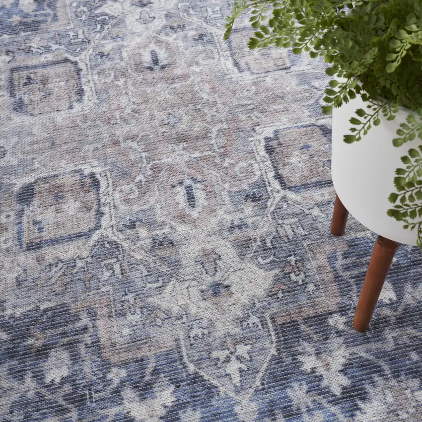 8' Blue and Ivory Floral Power Loom Distressed Washable Runner Rug Photo 9