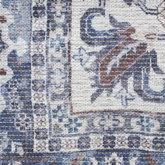 8' Blue and Ivory Floral Power Loom Distressed Washable Runner Rug Photo 1