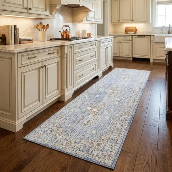 8' Blue and Ivory Oriental Power Loom Distressed Runner Rug With Fringe Photo 1