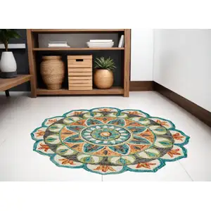 Photo of 5' Blue and Ivory Round Wool Floral Hand Tufted Area Rug