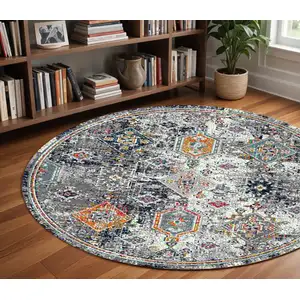 Photo of 7' Blue and Orange Round Geometric Power Loom Area Rug