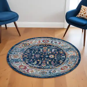 Photo of 6' Blue and Orange Round Oriental Power Loom Area Rug
