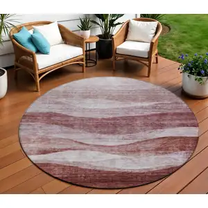 Photo of 8' Blush And Brown Round Abstract Washable Indoor Outdoor Area Rug