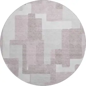 Photo of 8' Blush And Ivory Abstract Geometric Washable Round Rug With UV Protection