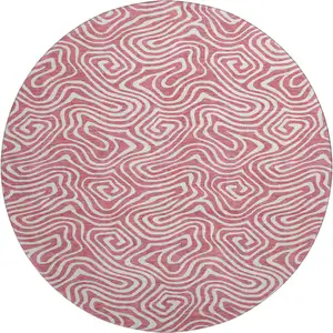 Photo of 8' Blush And Ivory Abstract Washable Round Rug With UV Protection