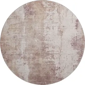 Photo of 8' Blush And Ivory Abstract Washable Round Rug With UV Protection
