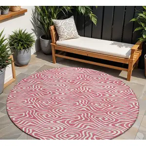 Photo of 8' Blush And Ivory Round Abstract Washable Indoor Outdoor Area Rug
