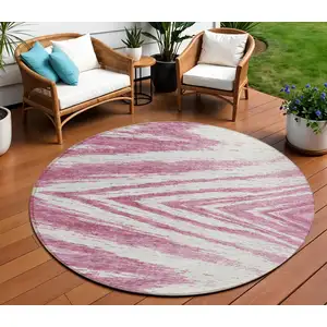 Photo of 8' Blush And Ivory Round Abstract Washable Indoor Outdoor Area Rug