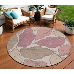 Photo of 8' Blush And Ivory Round Botanical Leaves Washable Indoor Outdoor Area Rug