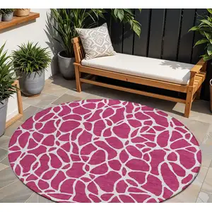 Photo of 8' Blush And Ivory Round Geometric Washable Indoor Outdoor Area Rug