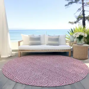 Photo of 8' Blush And Ivory Round Geometric Washable Indoor Outdoor Area Rug