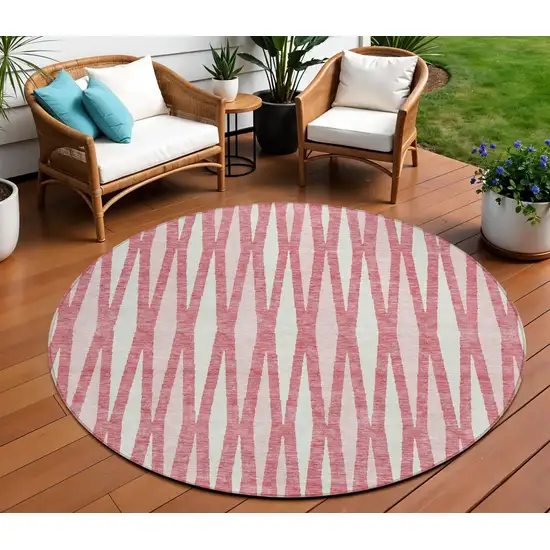 8' Blush And Ivory Round Geometric Washable Indoor Outdoor Area Rug Photo 1