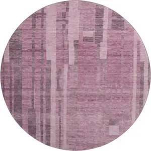 Photo of 8' Blush And Mauve Striped Washable Round Rug With UV Protection