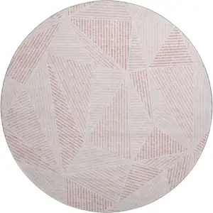 Photo of 8' Blush And Pink Geometric Washable Round Rug With UV Protection