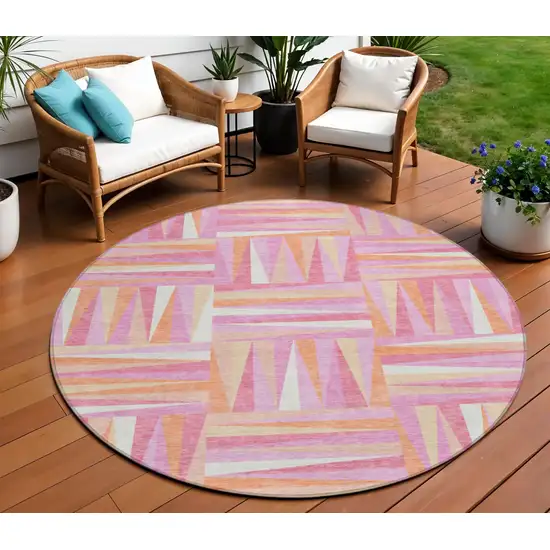 8' Blush Ivory And Orange Round Geometric Washable Indoor Outdoor Area Rug Photo 1