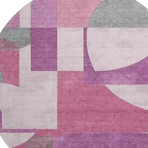 Photo of 8' Blush Mauve And Ivory Abstract Geometric Washable Round Rug With UV Protection