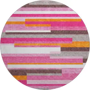 Photo of 8' Blush Orange And Gray Striped Washable Round Rug With UV Protection