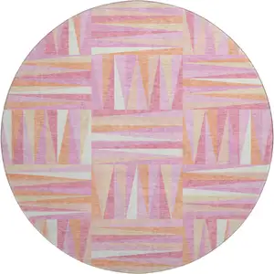 Photo of 8' Blush Peach And Ivory Geometric Washable Round Rug With UV Protection