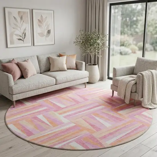 8' Blush Peach And Ivory Geometric Washable Round Rug With UV Protection Photo 1