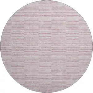 Photo of 8' Blush Pink And Beige Striped Washable Round Rug With UV Protection