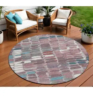 Photo of 8' Blush Pink And Merlot Round Abstract Washable Indoor Outdoor Area Rug