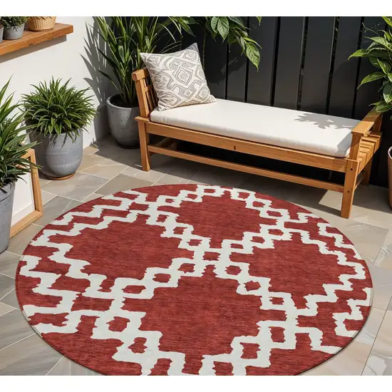 8' Brick Red And Ivory Round Geometric Washable Indoor Outdoor Area Rug Photo 1