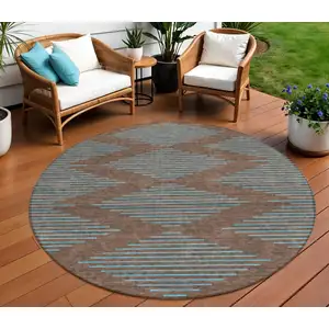 Photo of 8' Brown And Aqua Round Geometric Washable Indoor Outdoor Area Rug