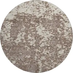 Photo of 8' Brown And Beige Abstract Washable Round Rug With UV Protection