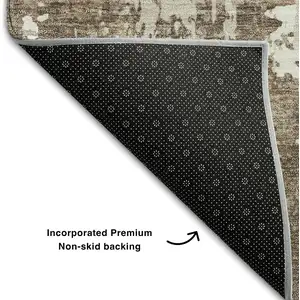 Photo of 8' Brown And Beige Abstract Washable Round Rug With UV Protection