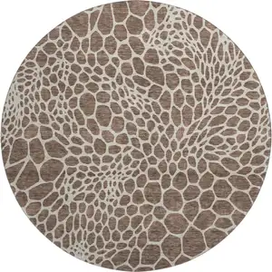 Photo of 8' Brown And Beige Geometric Washable Round Rug With UV Protection
