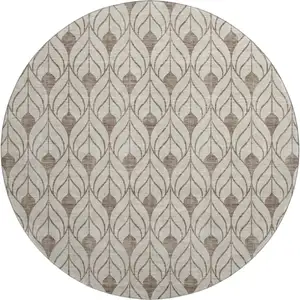 Photo of 8' Brown And Beige Geometric Washable Round Rug With UV Protection
