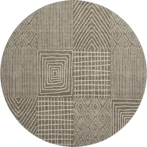 Photo of 8' Brown And Beige Geometric Washable Round Rug With UV Protection