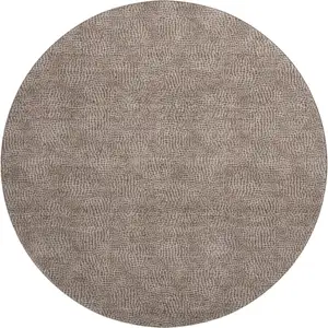 Photo of 8' Brown And Beige Geometric Washable Round Rug With UV Protection