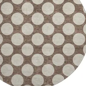 Photo of 8' Brown And Beige Polka Dot Washable Round Rug With UV Protection