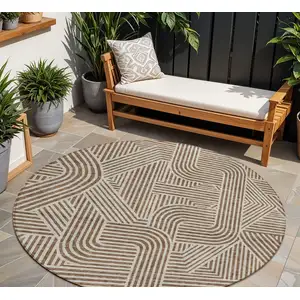 Photo of 8' Brown And Beige Round Abstract Washable Indoor Outdoor Area Rug