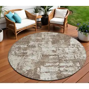 Photo of 8' Brown And Beige Round Abstract Washable Indoor Outdoor Area Rug