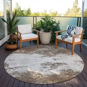 Photo of 8' Brown And Beige Round Abstract Washable Indoor Outdoor Area Rug