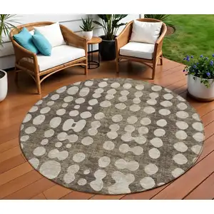 Photo of 8' Brown And Beige Round Abstract Washable Indoor Outdoor Area Rug