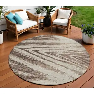 Photo of 8' Brown And Beige Round Abstract Washable Indoor Outdoor Area Rug
