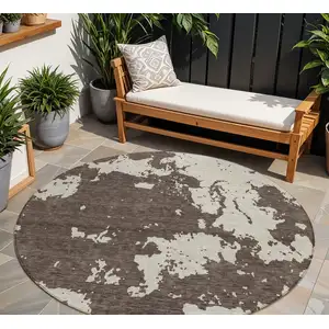 Photo of 8' Brown And Beige Round Abstract Washable Indoor Outdoor Area Rug