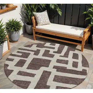 Photo of 8' Brown And Beige Round Abstract Washable Indoor Outdoor Area Rug