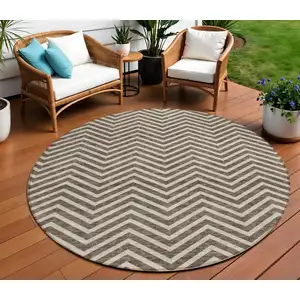 Photo of 8' Brown And Beige Round Chevron Washable Indoor Outdoor Area Rug