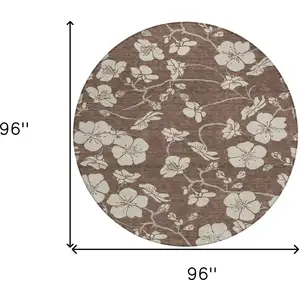 Photo of 8' Brown And Beige Round Floral Washable Indoor Outdoor Area Rug
