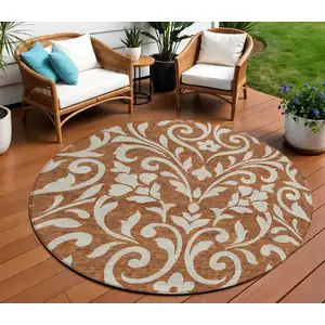 Photo of 8' Brown And Beige Round Floral Washable Indoor Outdoor Area Rug