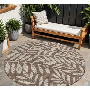 Photo of 8' Brown And Beige Round Floral Washable Indoor Outdoor Area Rug