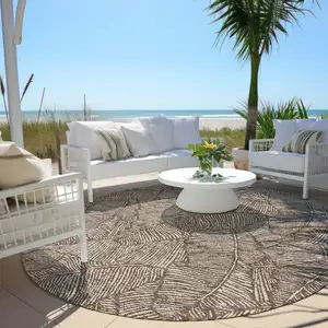 Photo of 8' Brown And Beige Round Floral Washable Indoor Outdoor Area Rug