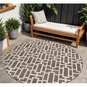 Photo of 8' Brown And Beige Round Geometric Washable Indoor Outdoor Area Rug