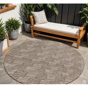 Photo of 8' Brown And Beige Round Geometric Washable Indoor Outdoor Area Rug