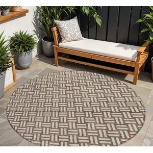 Photo of 8' Brown And Beige Round Geometric Washable Indoor Outdoor Area Rug